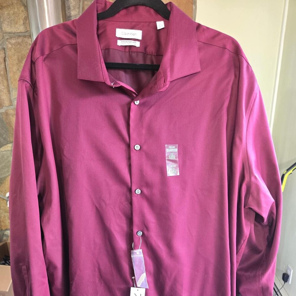Calvin Klein men's classic style button down, long sleeve shirt in burgundy. New